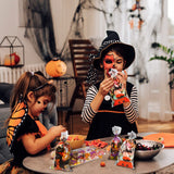 Halloween Treat Bags Set – 200 Cellophane Candy Bags with 240 Twist Ties (4 Festive Designs)