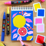 Uni POSCA 12-Color Acrylic Marker Set – 0.7 mm Fine Tip Pens for Posters, Crafts & Creative Design